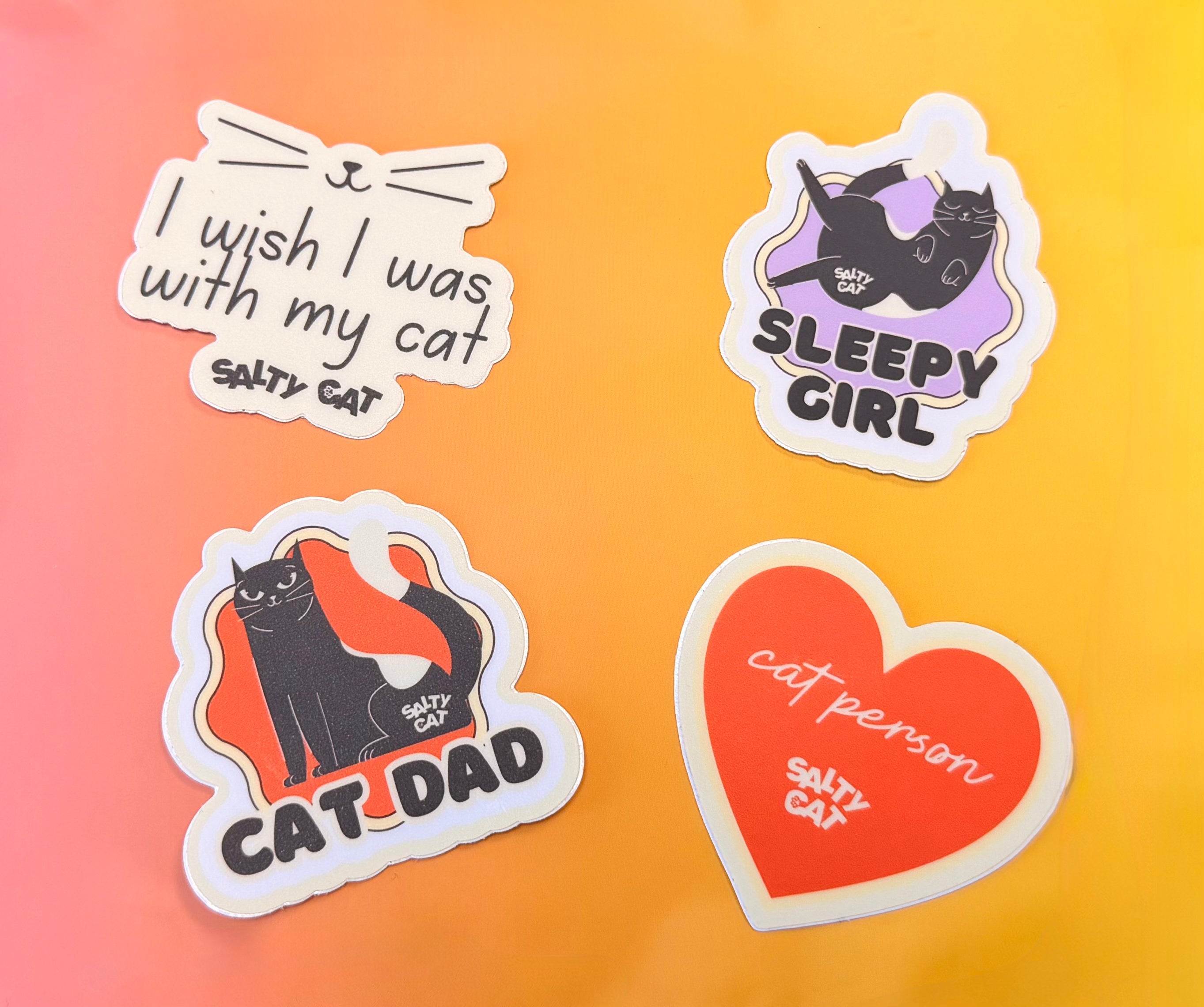 Salty Cat Surprise Sticker Bundle: 4 colorful cat stickers for bottles or phone cases.