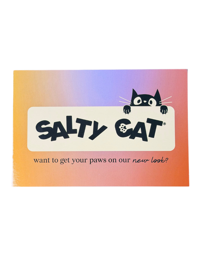 A cartoon cat peeks over a Salty Cat sign, dreaming of Goodie Bag treats and purées.